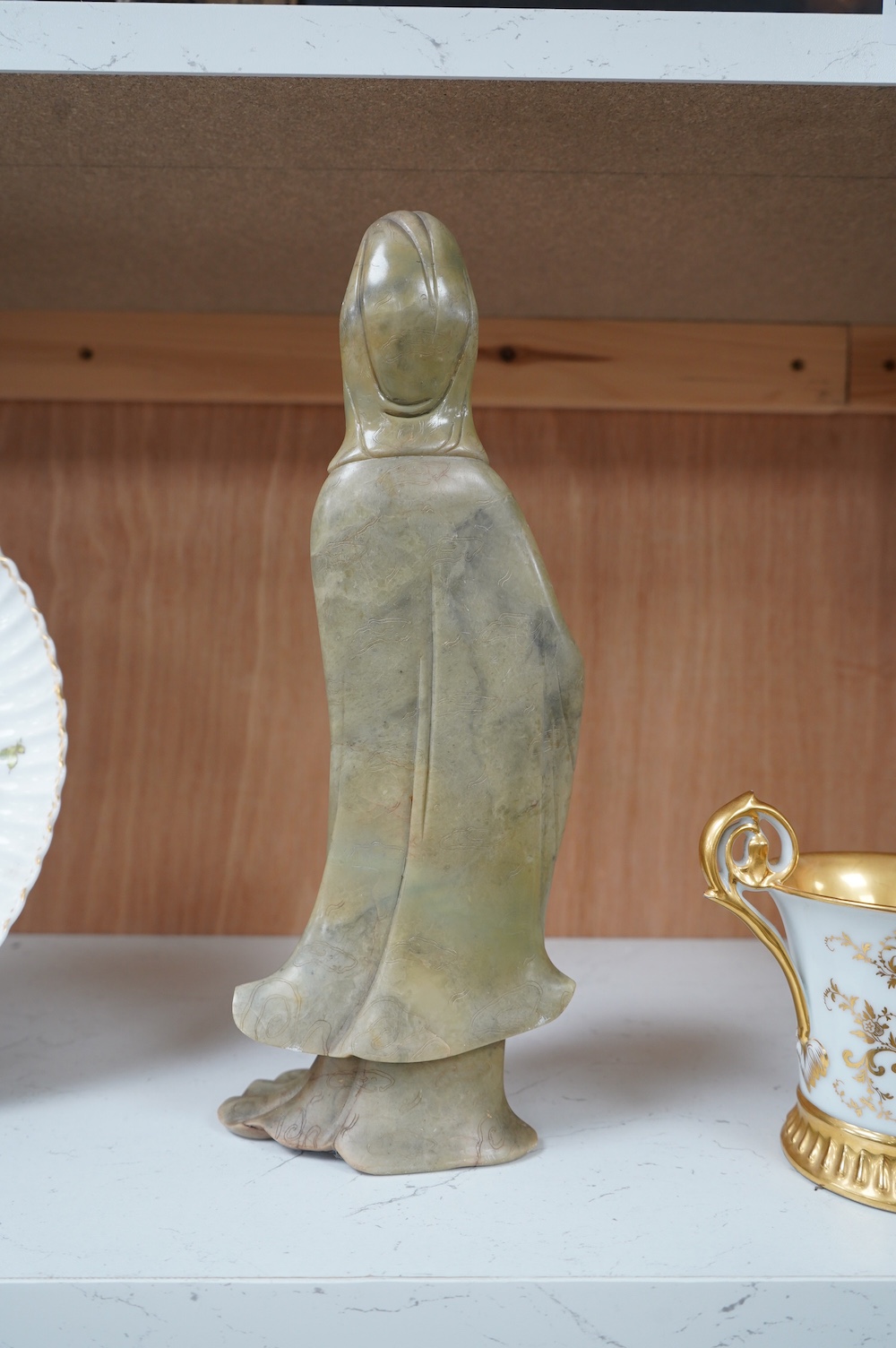 A Chinese soapstone figure of guanyin, 31cm high. Condition - good